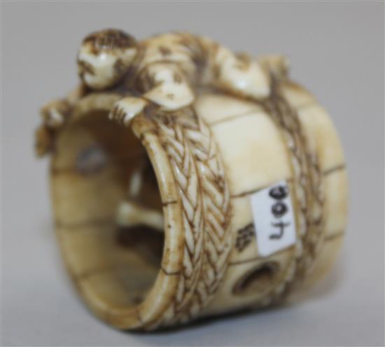 A Japanese ivory netsuke of two men constructing a barrel, Meiji period, 2.8cm